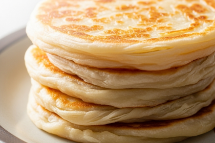 Discover the Art of Layered Flaky Griddled Roti Canai